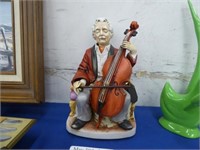 HAND PAINTED CERAMIC SCULPTURE OF A CELLOIST