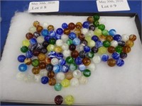 COLLECTION OF OVER 100 WHITE BASED SWIRL MARBLES.