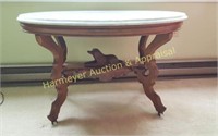 Cincinnati marble top oval walnut dog table