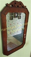 Burl wood framed wall mirror with decorated edges