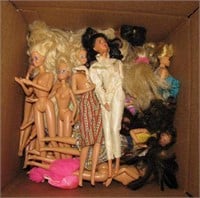 50 assorted Barbies plus a bag of clothers