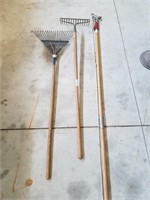 Two Lawn Rakes And An 8ft Branch Trimmer.