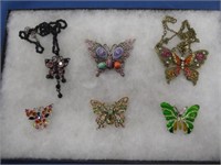 4 BEJEWELED BUTTERFLY BROOCHES AND 2 PENDANTS WITH
