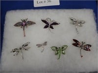 7 BEJEWELED DRAGON FLY BROOCHES.