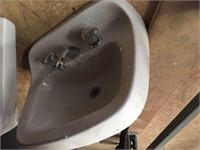 Mansfield porcelain sink with hardware.