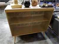 blond glass front bookcase