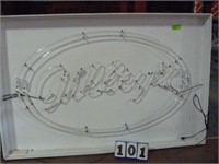 Gilleys red neon sign mounted in white wood frame