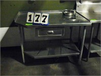 Stainless steel table, 30 in by 40 in, with