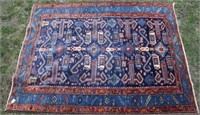 EARLY 20TH C CAUCASIAN RUG WITH A DRAMATIC NAVY