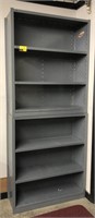 2 stacked metal shelves