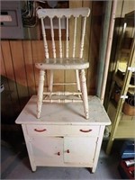White wooden chair with white 3-drawer cupboard