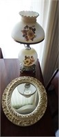 Electric floral lamp and oval wall mirror