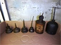 Six oil cans- assorted size