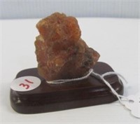 Carnelian Agate on wood stand. Measures 2" tall.