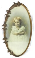 Baby Picture In Brass Oval Frame