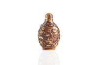 CHINESE NATURAL CARVED AND GILT SNUFF BOTTLE