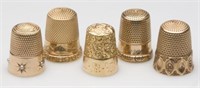 Approximately 100 gold thimbles
