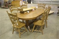 OAK TABLE W/ (2) LEAVES AND (6) MATCHING CHAIRS