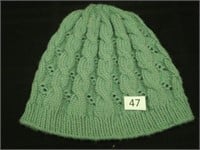 Green cable knit hat - Annabella Gilkes/Hand Knit