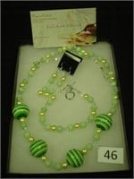 Green bead and pearl necklace, earrings, and brace