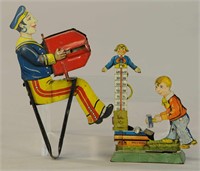 TWO GELY GERMAN HAND ACTIVATED TOYS