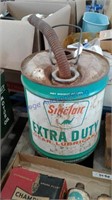 Sinclair lubricant can-- dented