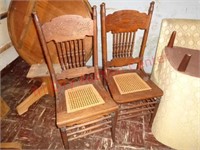 2 antique press back cane seat chairs