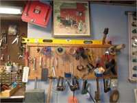 Job lot tools on wall - clamps, wrenches, 4' level
