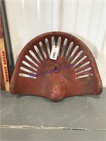 Red cast iron seat (18"), has crack