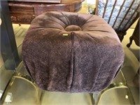 Upholstered And Tufted Ottoman.