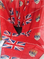 A BANNER OF NINE UNCUT "CANADIAN RED ENSIGN" FLAGS