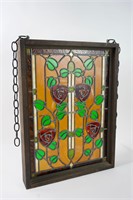 Antique stained glass window in wooden frame