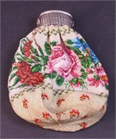 A beaded purse decorated with roses, green
