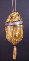 An yellow and white enameled steel mesh purse with