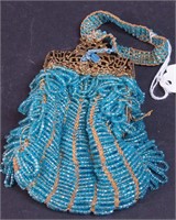 A petite wristlet purse with turquoise beads