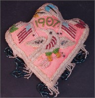 A 1907 Iroquois beaded souvenir pincushion