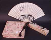A woman's autographed fan with painted