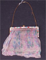 A pastel mesh bag with green silk lining