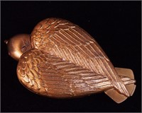 A Salvador Dali Bird-in-Hand compact,