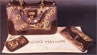 A Louis Vuitton dark chocolate purse with