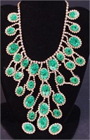 A marked Kenneth Lane bib necklace with matching
