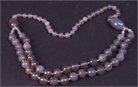 A smoky colored polished stone beaded necklace