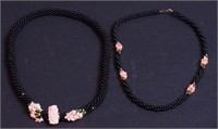 Two coral and onyx necklaces, one with carved