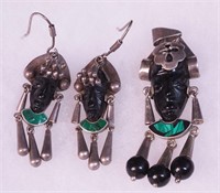 A pendant and matching earrings with black