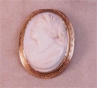 A carved shell cameo in 10K yellow gold frame
