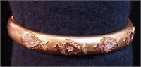 A yellow gold bangle bracelet, unmarked