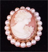 A carved shell cameo in gold frame marked 14K