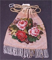 A draw-cord beaded purse decorated with roses