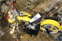 Yellow Indian Motor Cycle On Stand