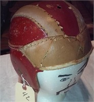 Old red and tan leather football helmet
